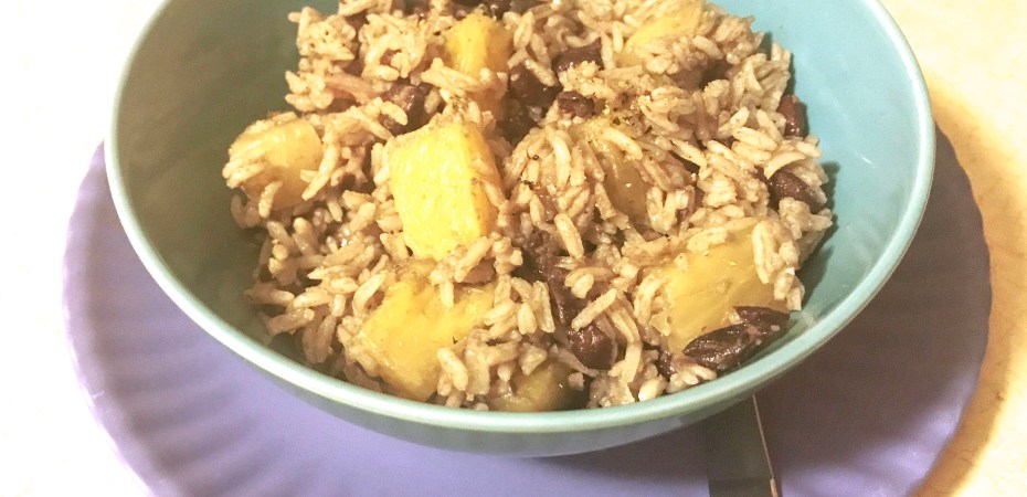 Bowl of black beans and pineapple and rice