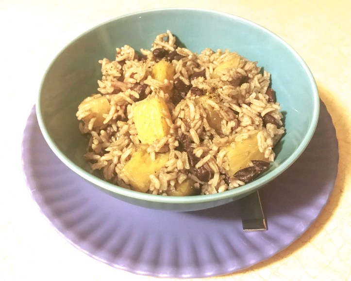 Bowl of black beans and pineapple and rice